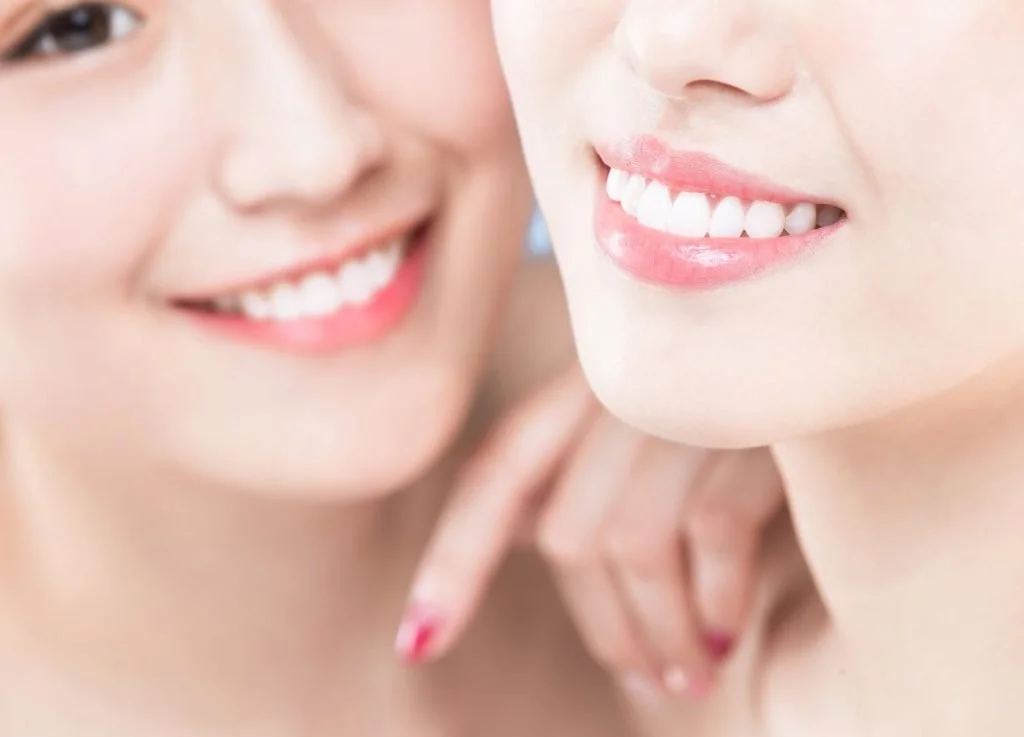 two women smiling at the camera